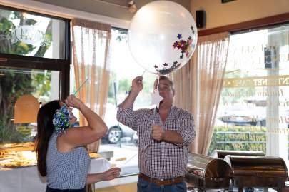 Stars popped balloons to reveal their dance coach. 